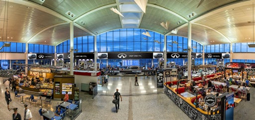 Astral banner boards displayed across Toronto Pearson's airport gate featuring Infiniti ad