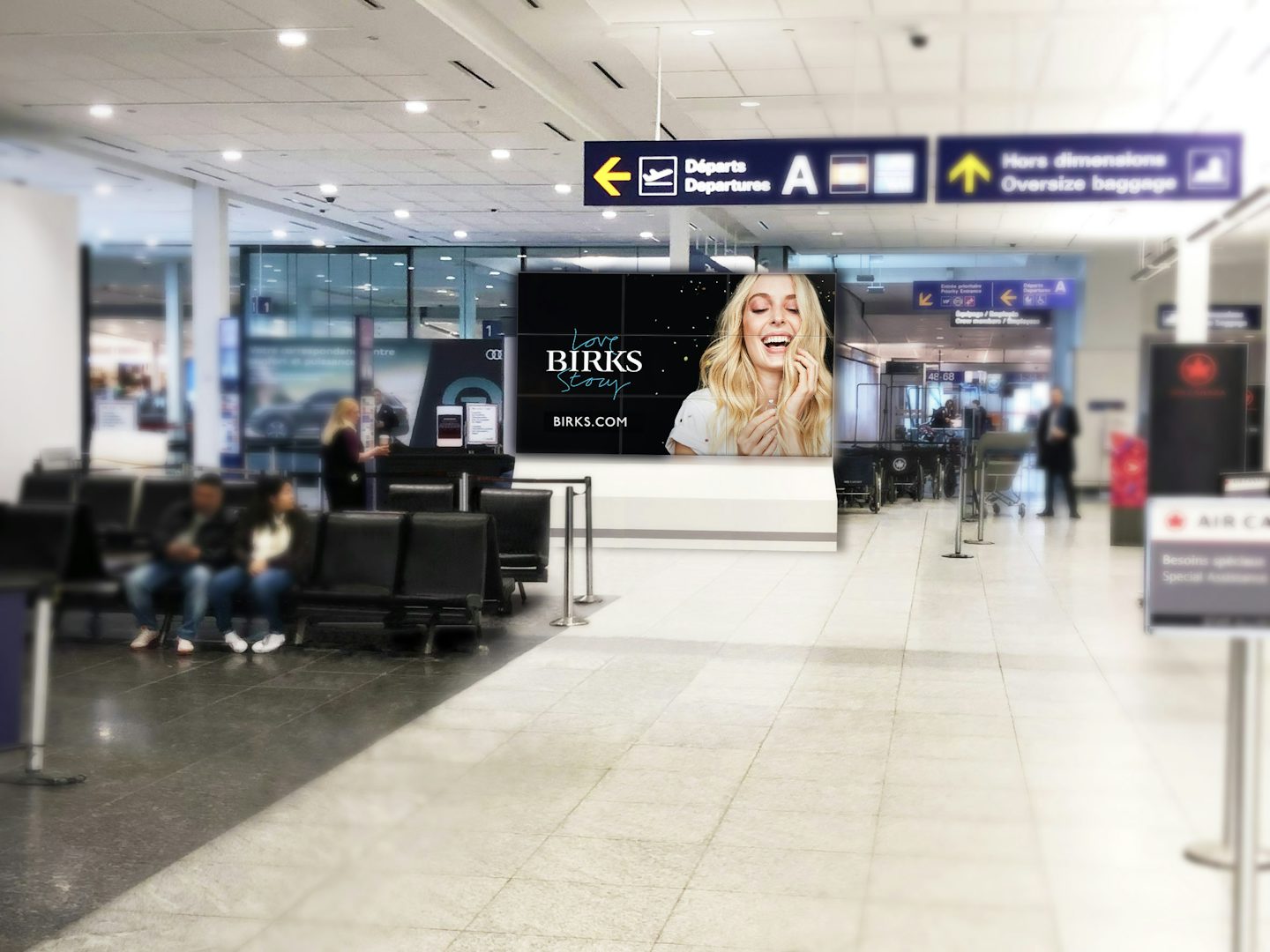 Digital Astral wall ad featuring a Birks ad inside Montreal's airport