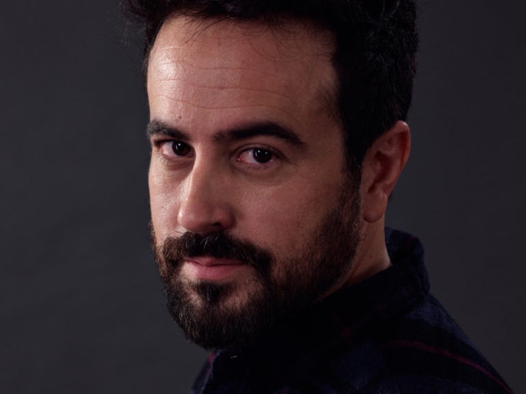 ADAM KORSON Image of Adam Korson as Father Phil Orley