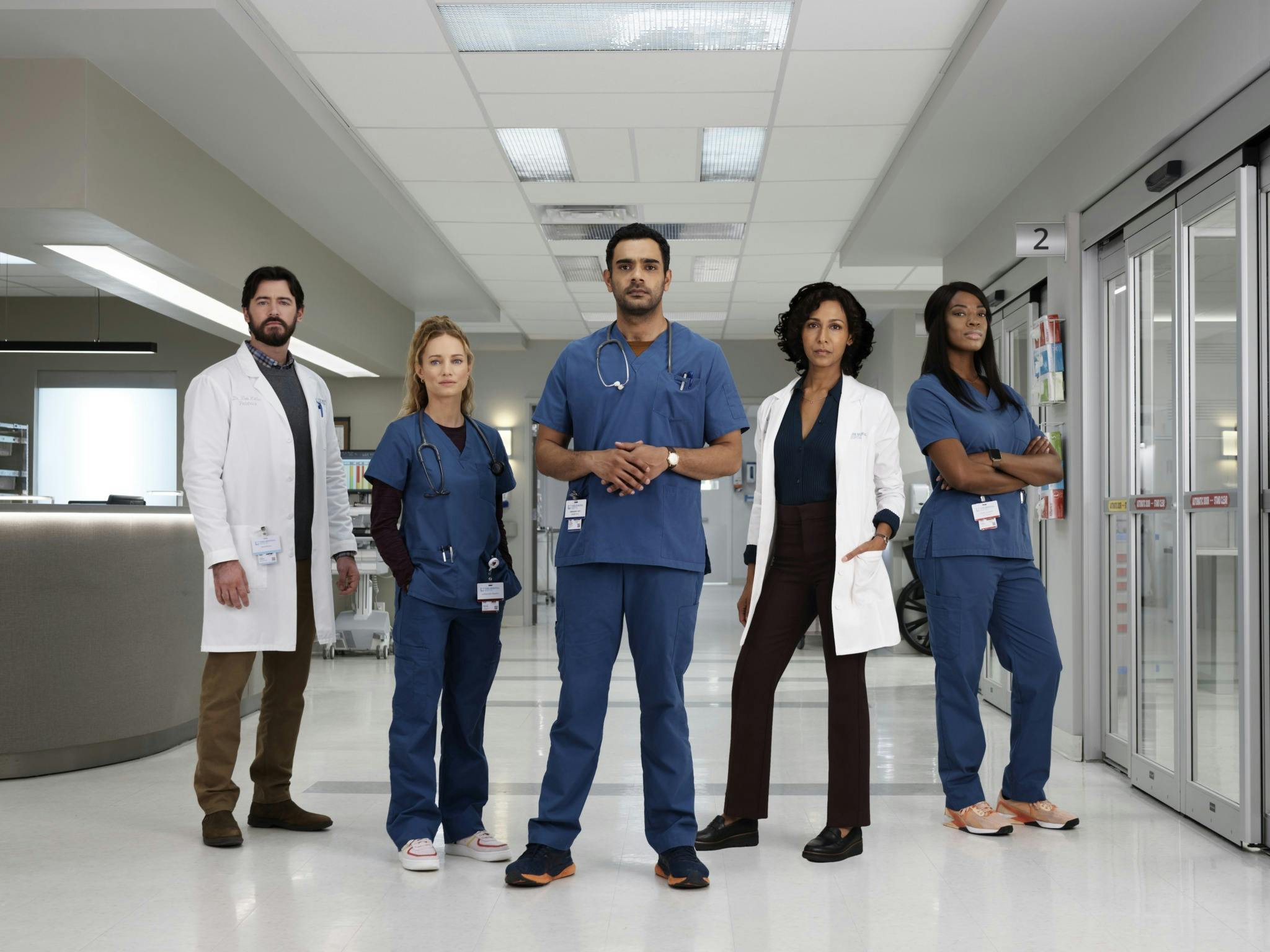 Standing in order from left to right, TRANSPLANT actors Jim Watson, Laurence Leboeuf, Hamza Haq, Rekha Sharma, and Ayisha Issa
