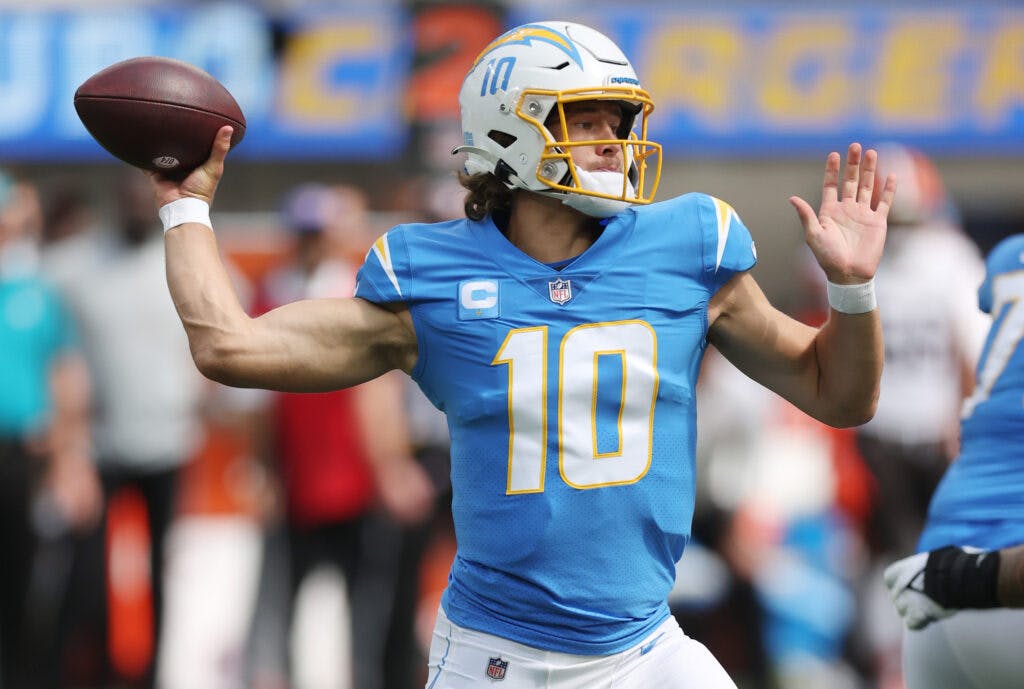 LA Chargers Quarterback Justin Herbert throwing a football during game