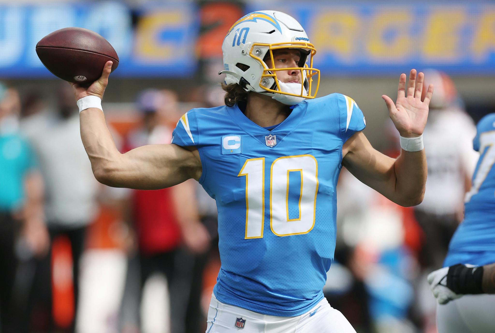 LA Chargers Quarterback Justin Herbert throwing a football during game