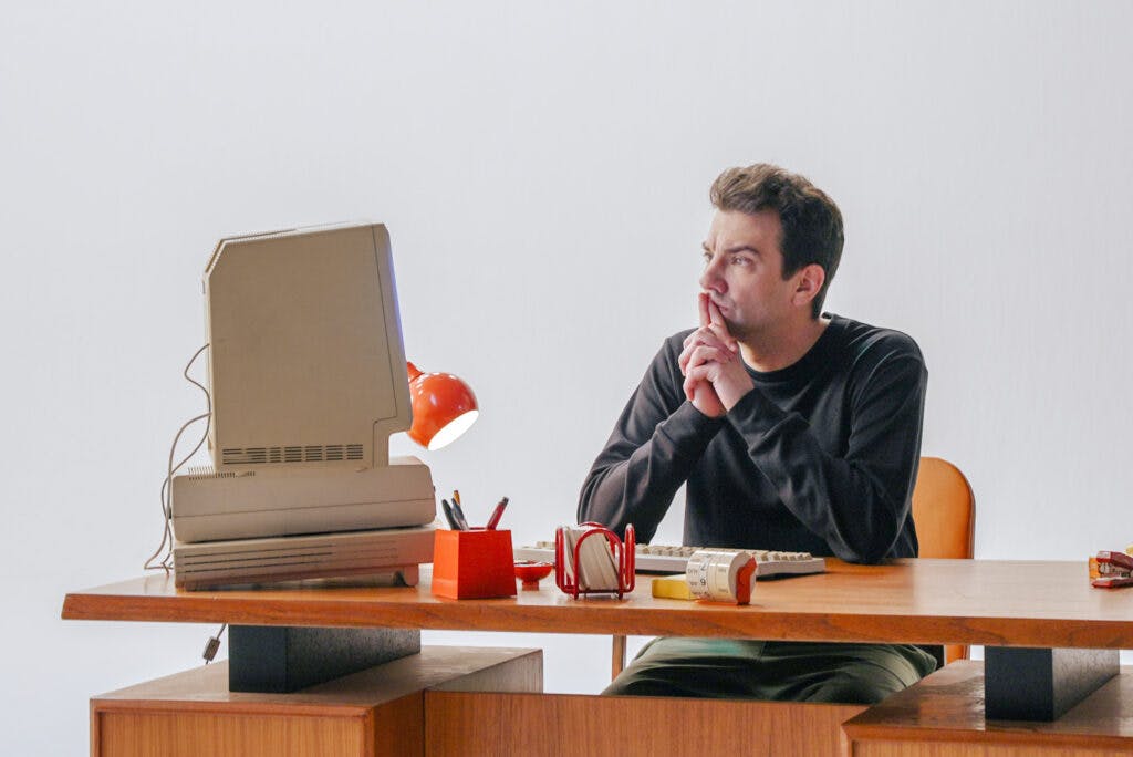 Jay thinking at desk