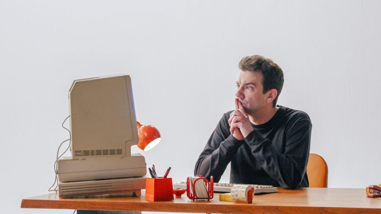 Jay thinking at desk