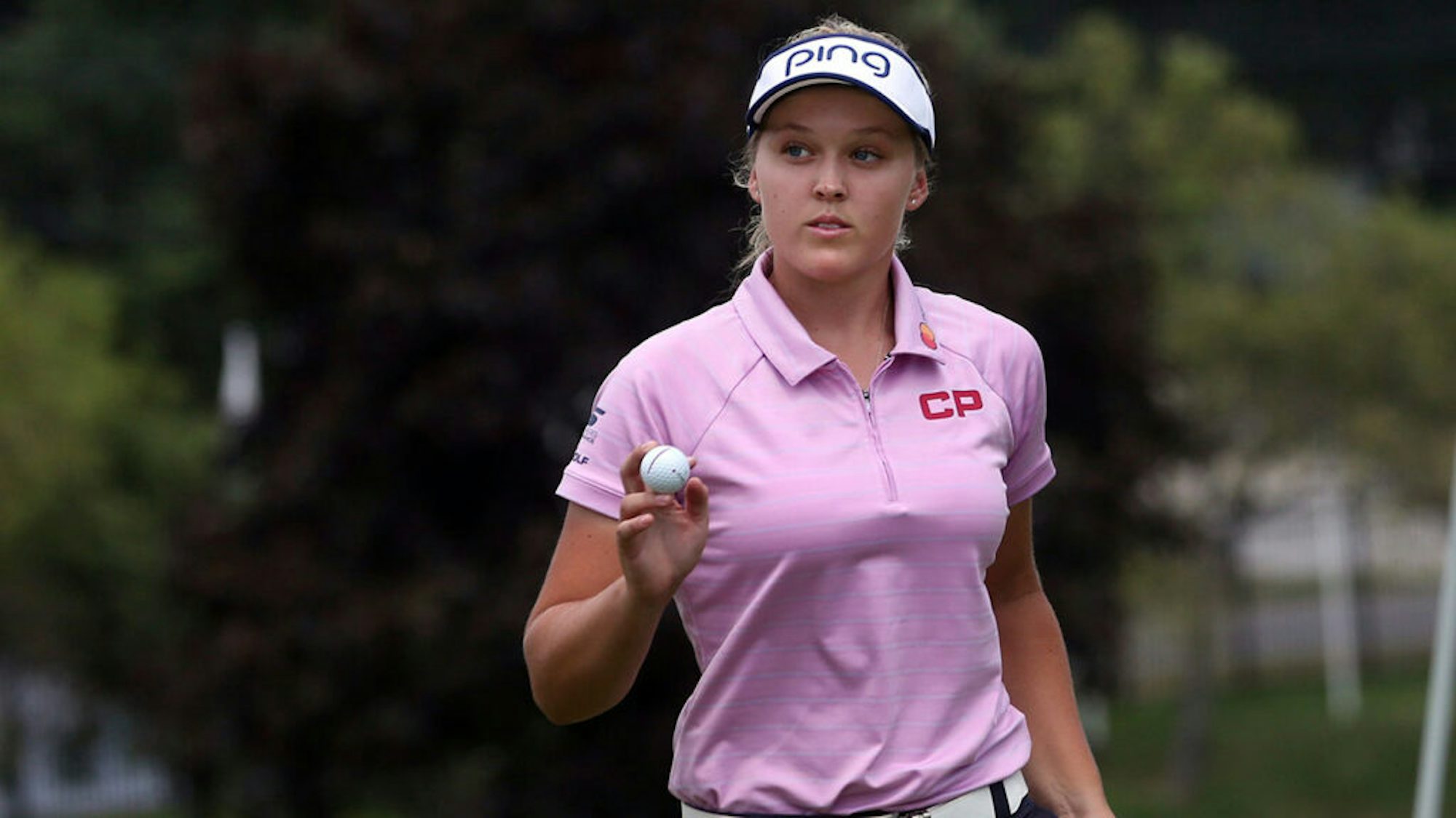 Brooke Henderson holding a golf ball